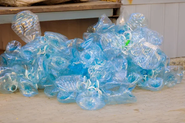A pile of rubbish from unusable crumpled plastic bottles