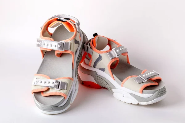 Womens, fashionable, sports sandals with orange accents on a white background. — Stock Photo, Image