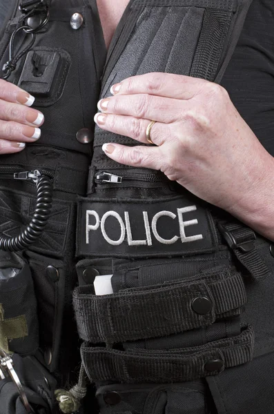 Αστυνομία τακτικής vest και τα χέρια του λειτουργού — Φωτογραφία Αρχείου