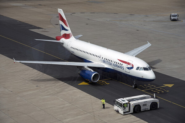 Passenger jet using new tarmac taxiway at London Gatwick Airport UK