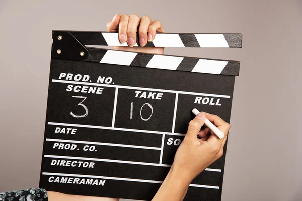 Writing on a film set clapper board