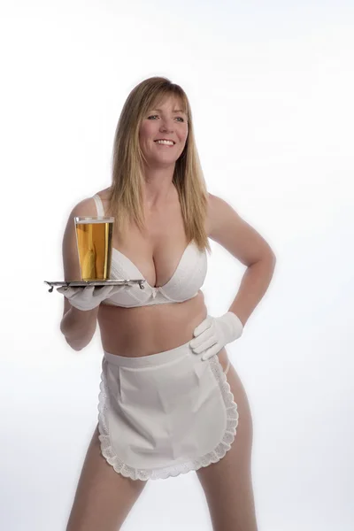 WAITRESS SERVING BEER FROM A TRA — Stock Photo, Image