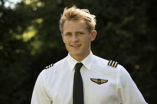 Young male airways crew member in uniform