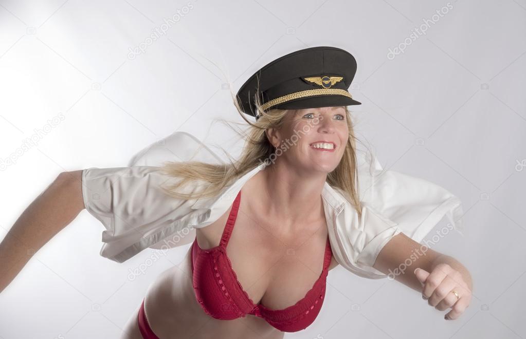 Woman in uniform revealing her red bra