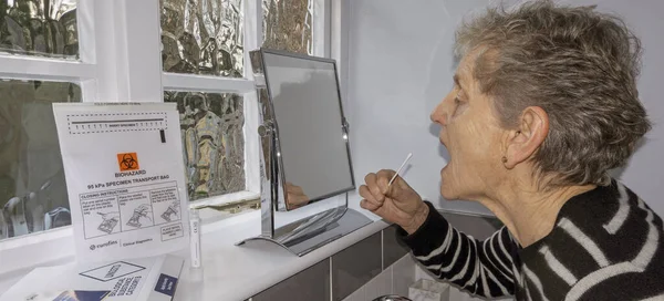 England 2021 Elderly Woman Using Swab Coronavirus Home Test Kit — Stock Photo, Image