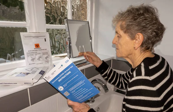 England 2021 Woman Bathroom Studying Instructions Coronavirus Covid Home Test — Stock Photo, Image