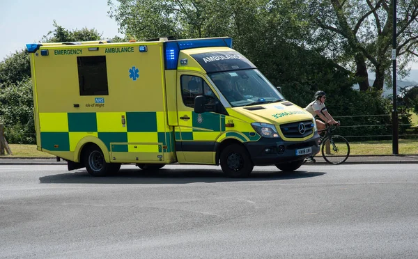 Isle Wight England 2021 Emergency Ambulance Passing Woman Cyclist Yarmouth — Zdjęcie stockowe