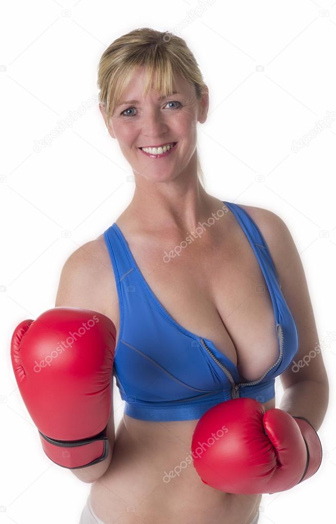 Female boxer wearing sports bra and red gloves