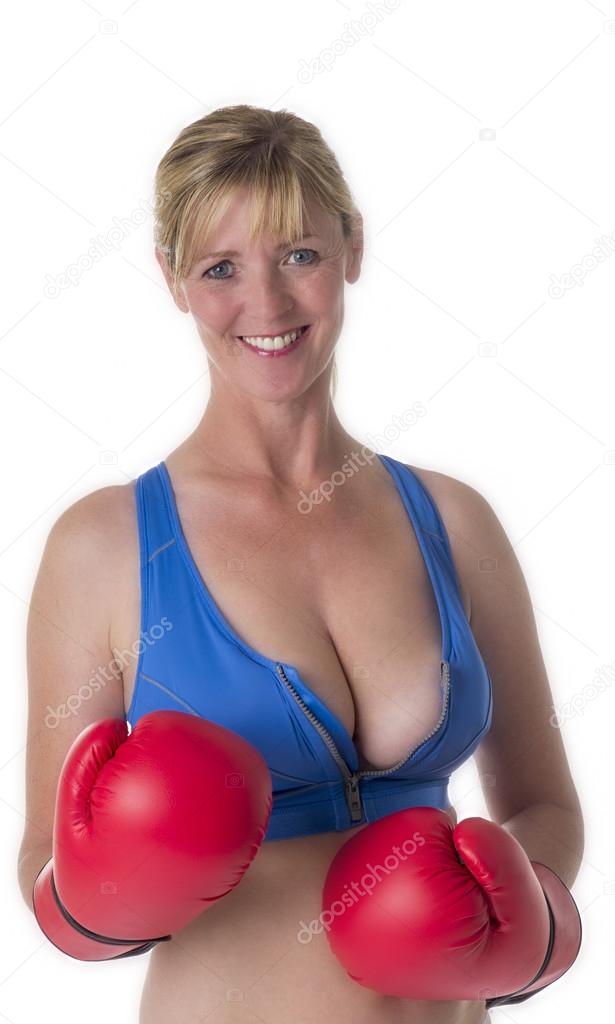 Female boxer wearing sports bra and red gloves