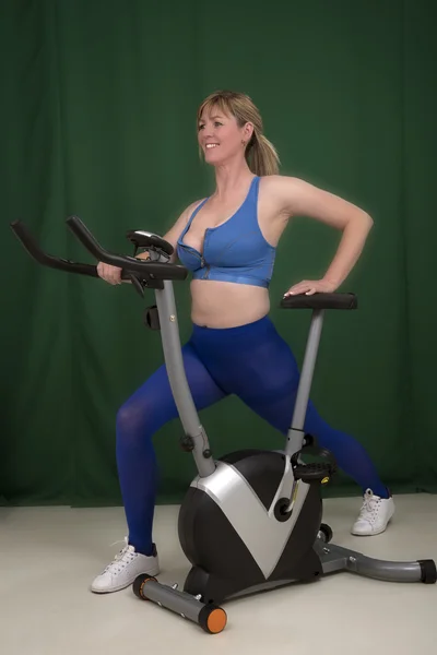 Exercise workout before riding an exercise bike — Stock Photo, Image