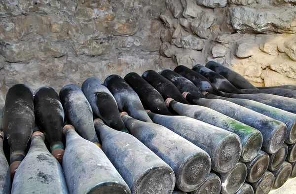 The ancient bottles of wine in the ancient cellar