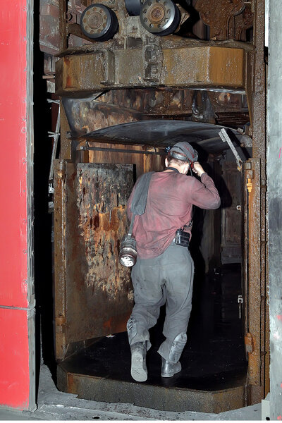 miner down in the lift under the ground