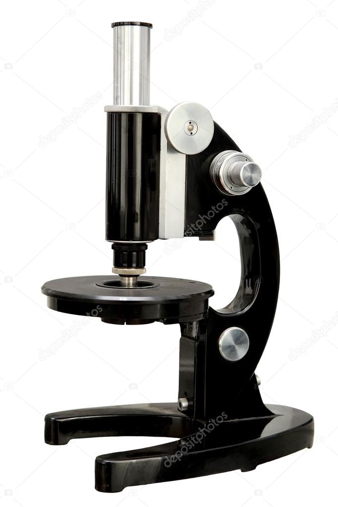 Old microscope on a white background.Isolated old microscope.