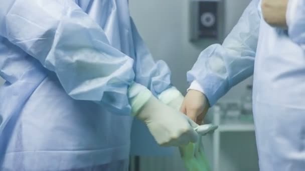 Doctor putting gloves — Stock Video