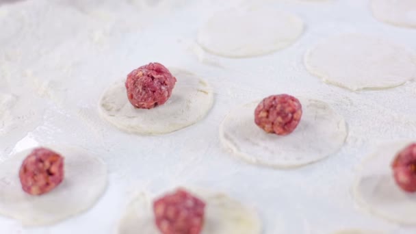 Chef puts meat ball on dough — Stock Video
