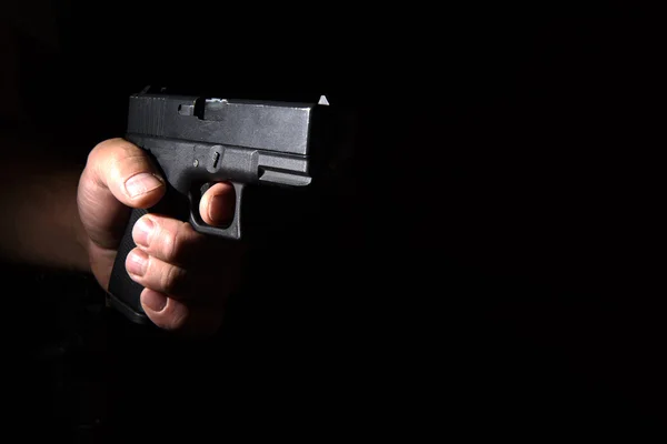 Glock pistol in his hand — Stock Photo, Image