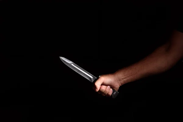 Man's hand with a knife — Stock Photo, Image