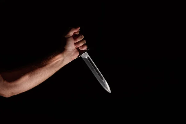 Man's hand with a knife — Stock Photo, Image