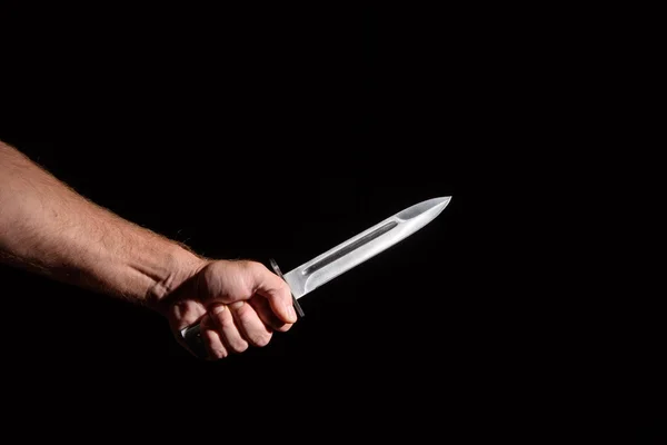 Man's hand with a knife — Stock Photo, Image