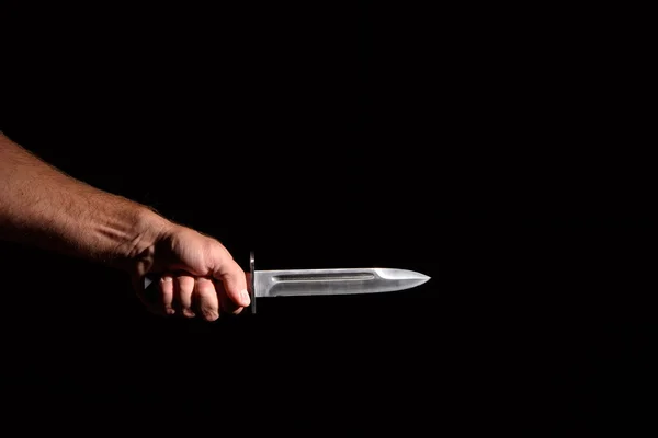 Man's hand with a knife — Stock Photo, Image