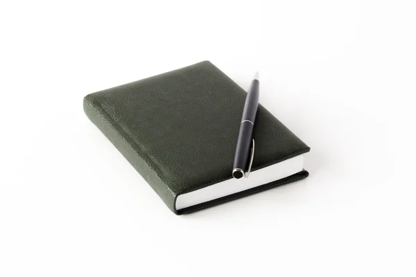 A notepad and a roller pen — Stock Photo, Image