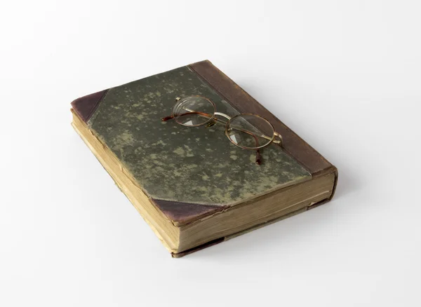 Old book and reading glasses — Stock Photo, Image