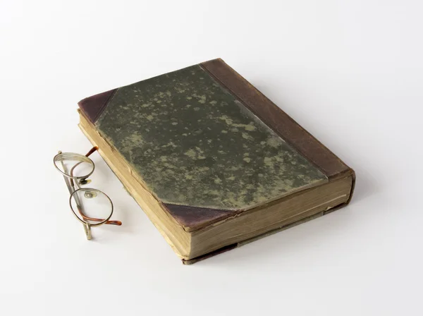 Old book and reading glasses — Stock Photo, Image