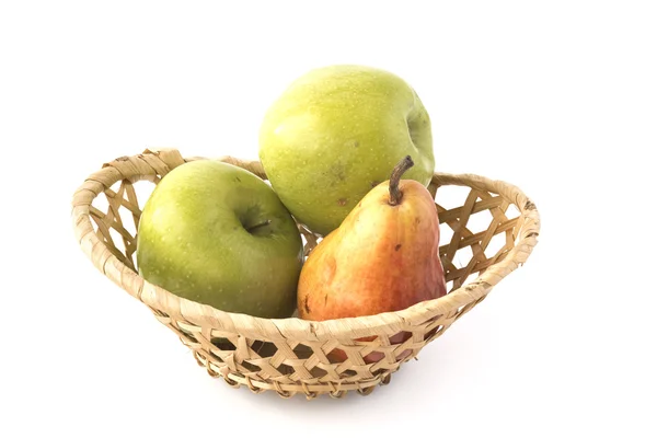 Apples and plum in wicker basket — Stock Photo, Image