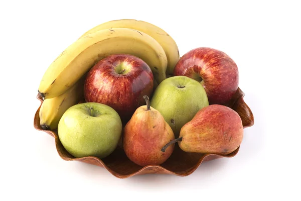 Some different fruits on a wooden dish — Stock Photo, Image