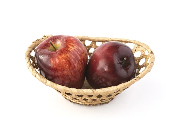Two red apples in a wicker basket — Stock Photo, Image