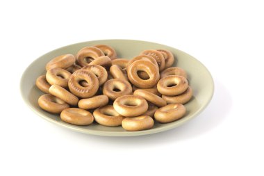 Yeşil plaka ile üstüne beyaz izole küçük altın simit