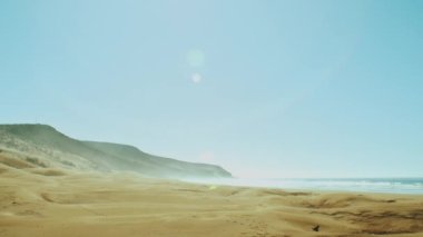 Amazing Sand Dunes by Beautiful Blue Ocean, Dahkla, Fas, Sunny Bunnies into camera, Slow motion, beautiful view to the ocean, Sunny weather and clear sky, Fas, 4k