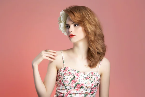 Beautiful woman with flower in hair — Stock Photo, Image