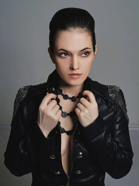 young woman in leather coat