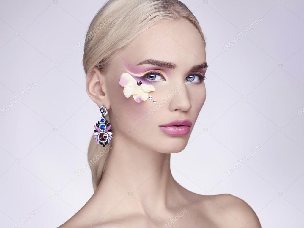 beautiful blond girl with flowers make-up