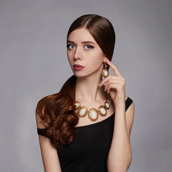 Beautiful young woman in black dress — Stock Photo, Image