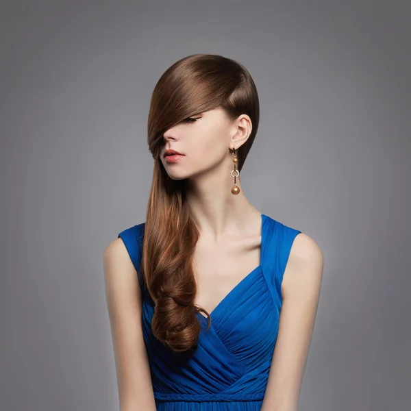 Beauitiful young woman in blue dress Stock Picture