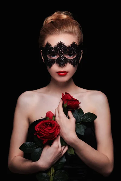 Girl in mask and flowers — Stock Photo, Image