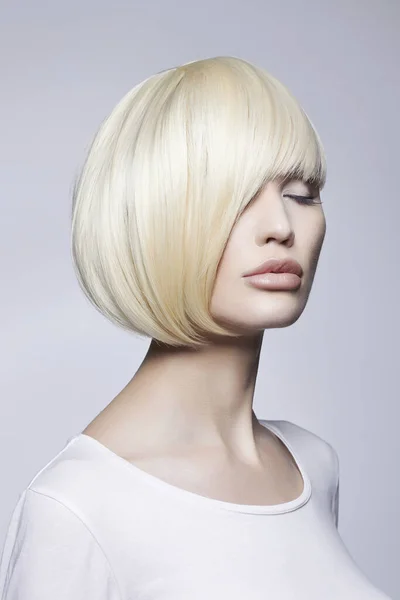 beauty portrait of young woman with stylish bob haircut. beautiful blond girl. lip augmentation