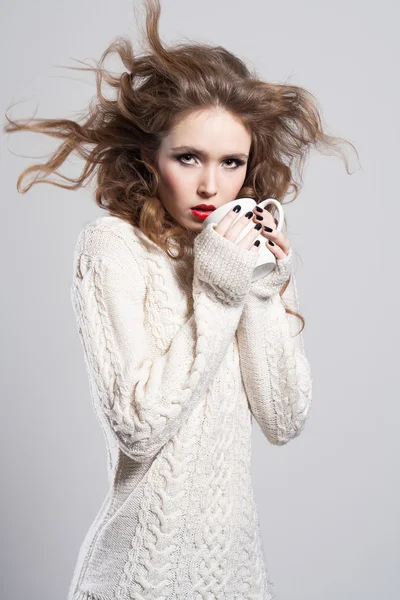 Beautyful young woman drinking coffee Stock Image