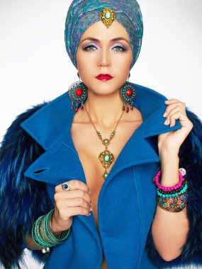 rich beautiful woman in fur and jewelry. clipart