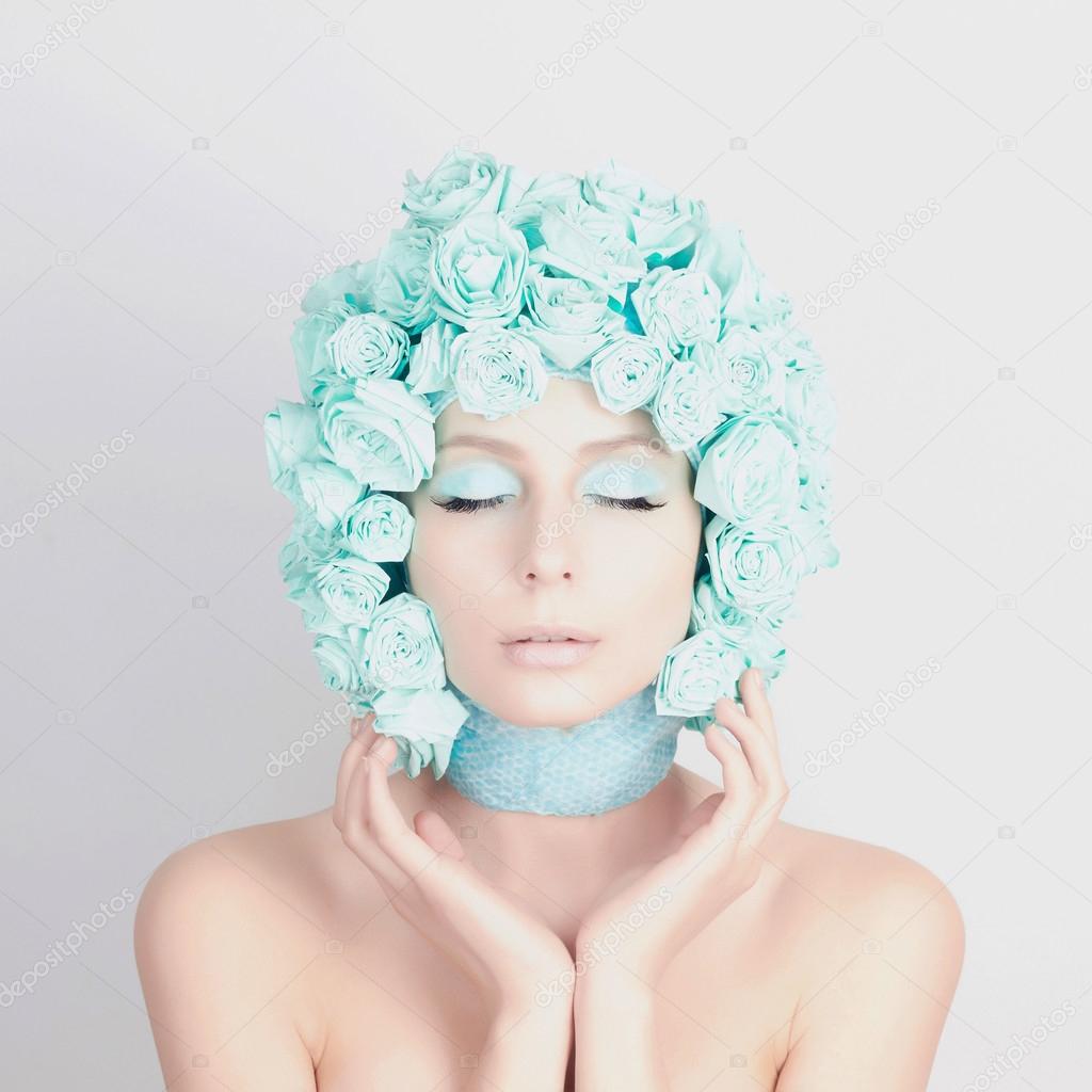 Young woman with blue flowers hair
