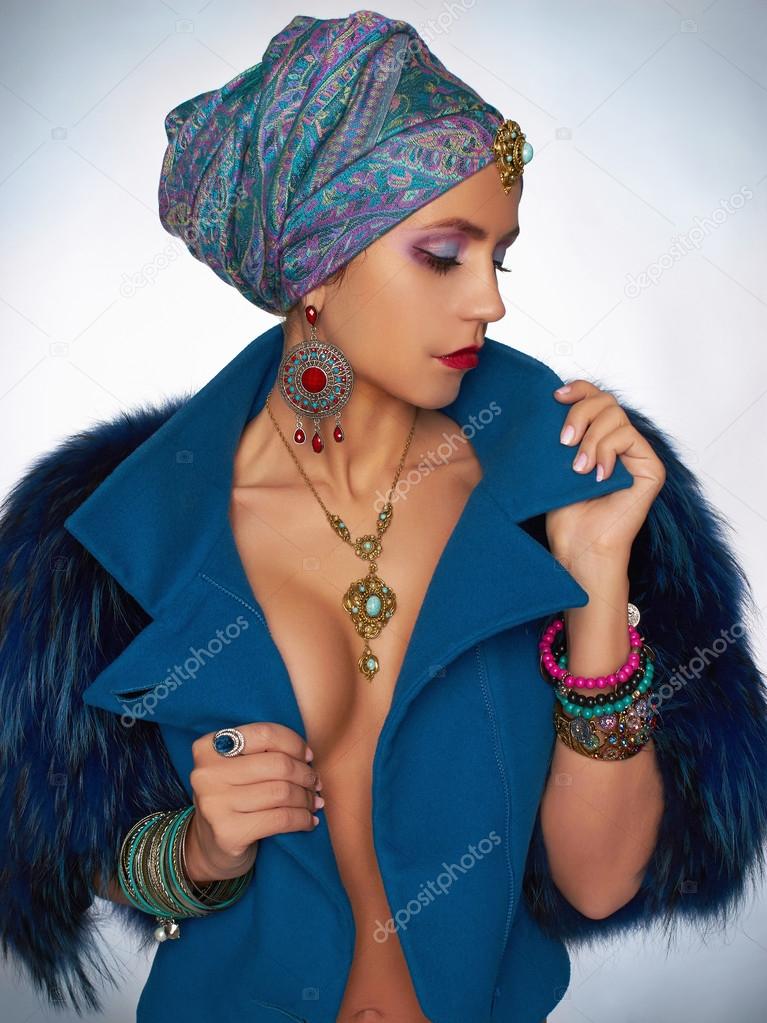 rich beautiful woman in fur and jewelry