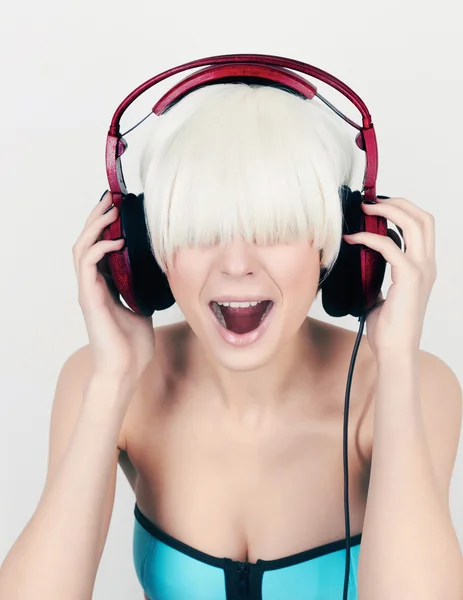 Screaming girl in headphones — Stock Photo, Image