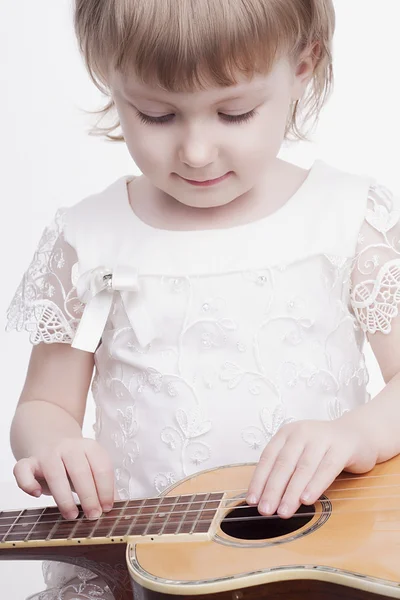Funny little girl with guitar — Stock Photo, Image