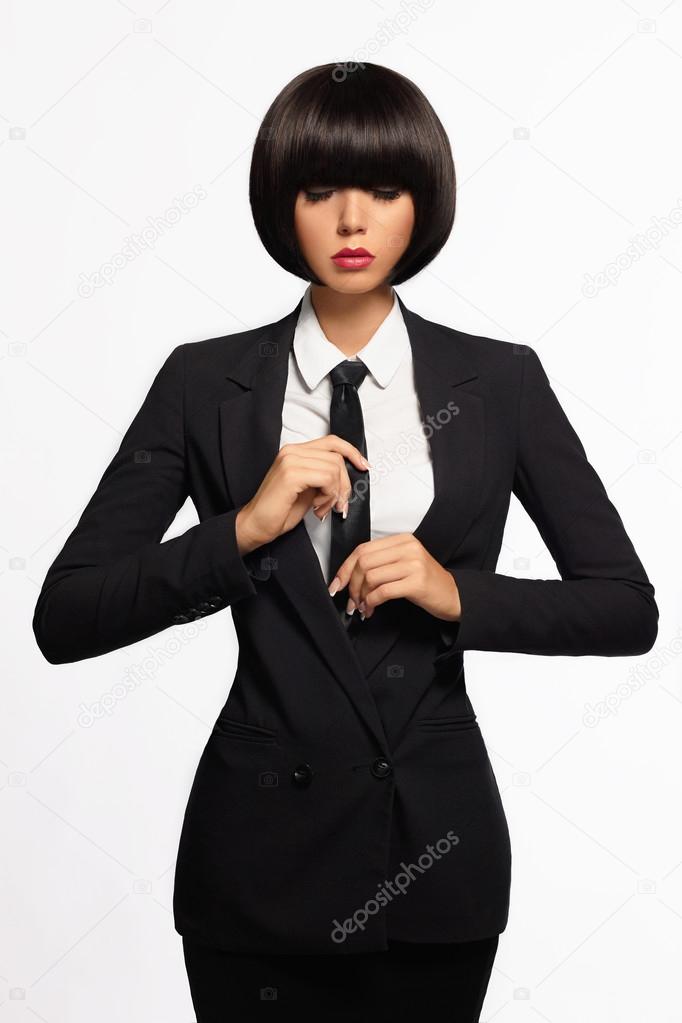 Close up portrait of a beautiful young african american woman with pigtails  hairstyle in a brown business suit walks along spring streets Stock Photo |  Adobe Stock