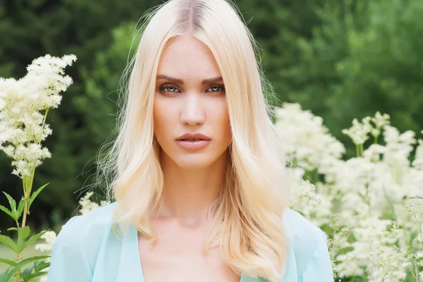 Beautiful Blond Woman with flowers — Stock Photo, Image