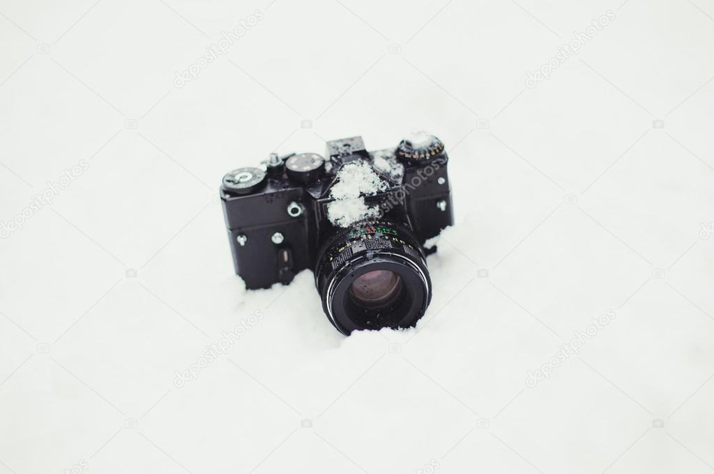 camera on snow background