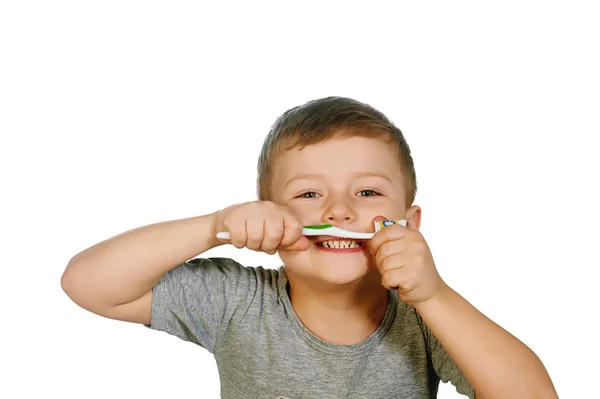 Gelukkig jongetje tandenpoetsen, geïsoleerd op wit. Tandheelkundige glimlacht. — Stockfoto