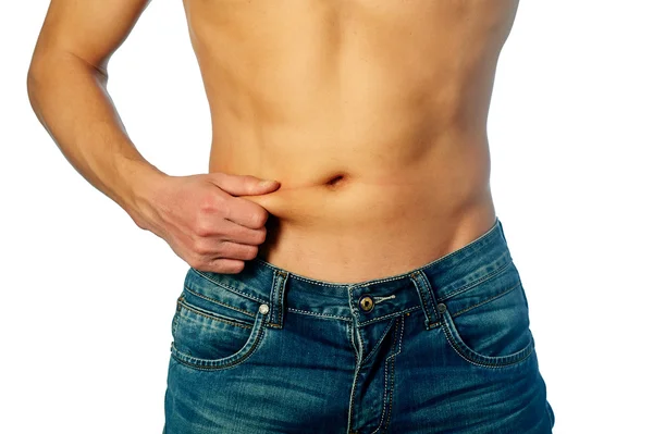 Young man measuring fat on belly — Stock Photo, Image